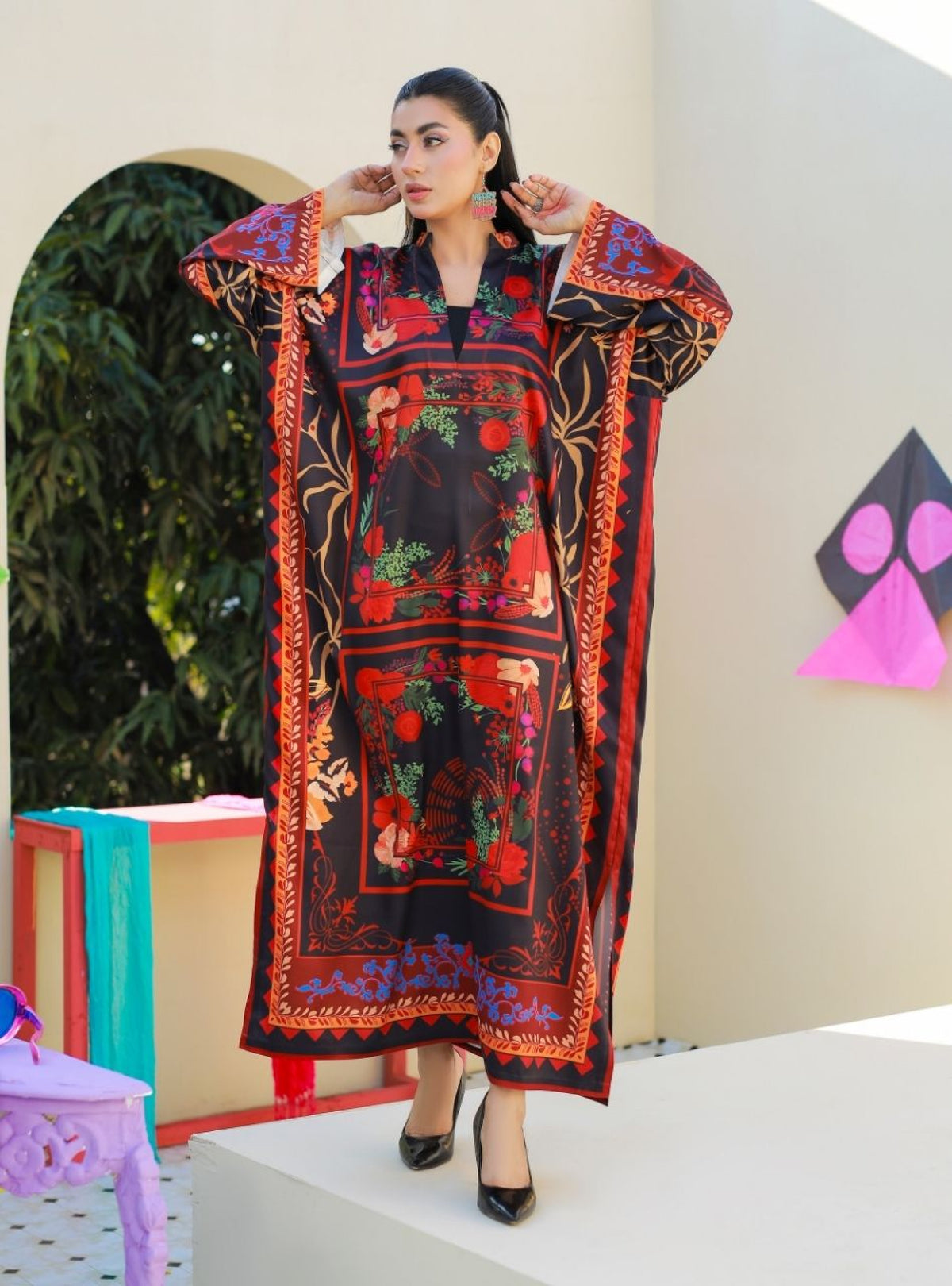 Woman wearing an elegant Anayra Amal dress in Poly Parsley fabric, featured at Buraq Store