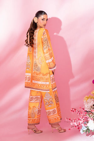 Girl wearing bold orange dress pakistani co ord set by buraqstore