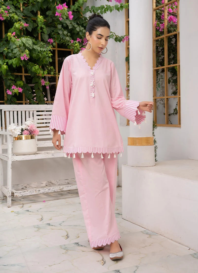 A girl dressed in co ord set for girls, close-up of the dori and lace detail on the cotton top, Buraqstore