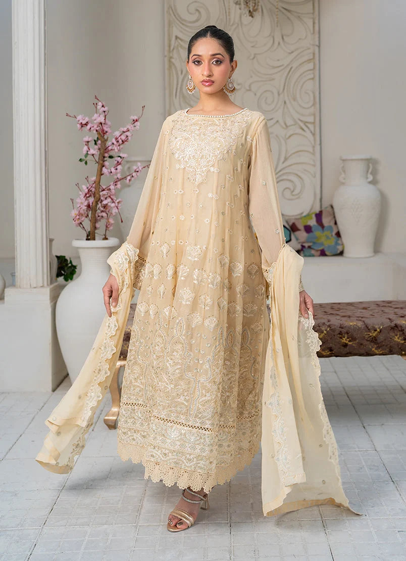 Model wearing beige color dress pakistani, side view showing the flow of the chiffon 3-piece set, Buraqstore