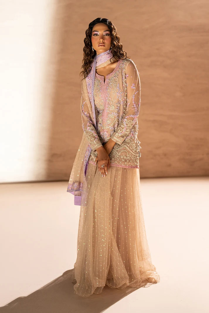 Model wearing beige net suit, side view showing the fall of the net 3PC set at Buraqstore