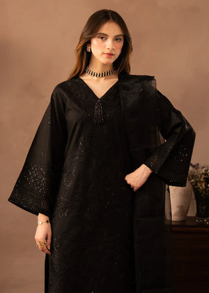 Model wearing black dress pakistani, side view showing the fit of the lawn shirt and trouser, Buraqstore