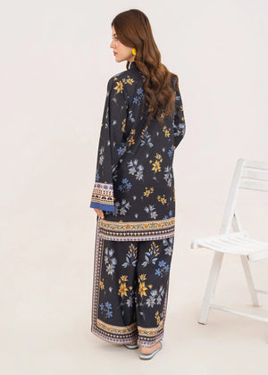 Model wearing black co ord set in a relaxed standing pose, printed grip 2-piece at Buraqstore