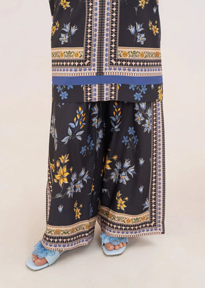 Model wearing black co ord set, close-up of the print on the grip top and bottom, Buraqstore
