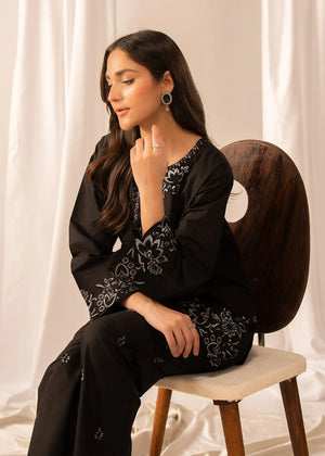 Women wearing black lawn dress, back view of the embroidered shirt and trouser, Buraqstore