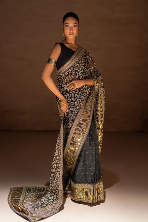 Women wearing black designer saree pakistan, side view showing the embellished border work, 2PC set at Buraqstore