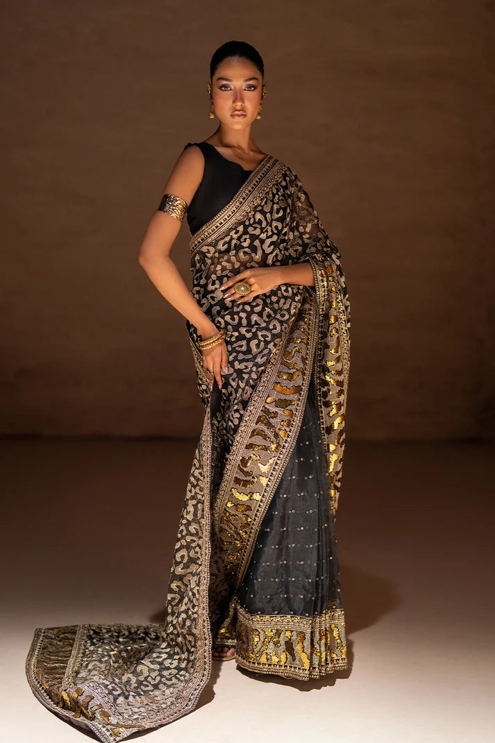 Women wearing black designer saree pakistan, side view showing the embellished border work, 2PC set at Buraqstore