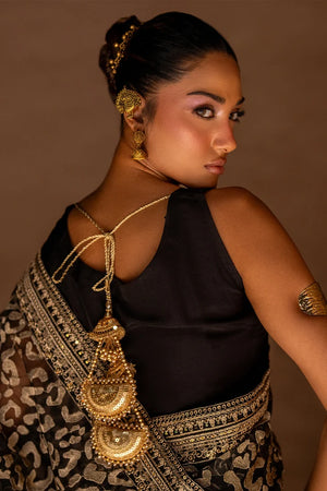 Model wearing black designer saree pakistan with matching organza blouse, back view of the draped saree, Buraqstore