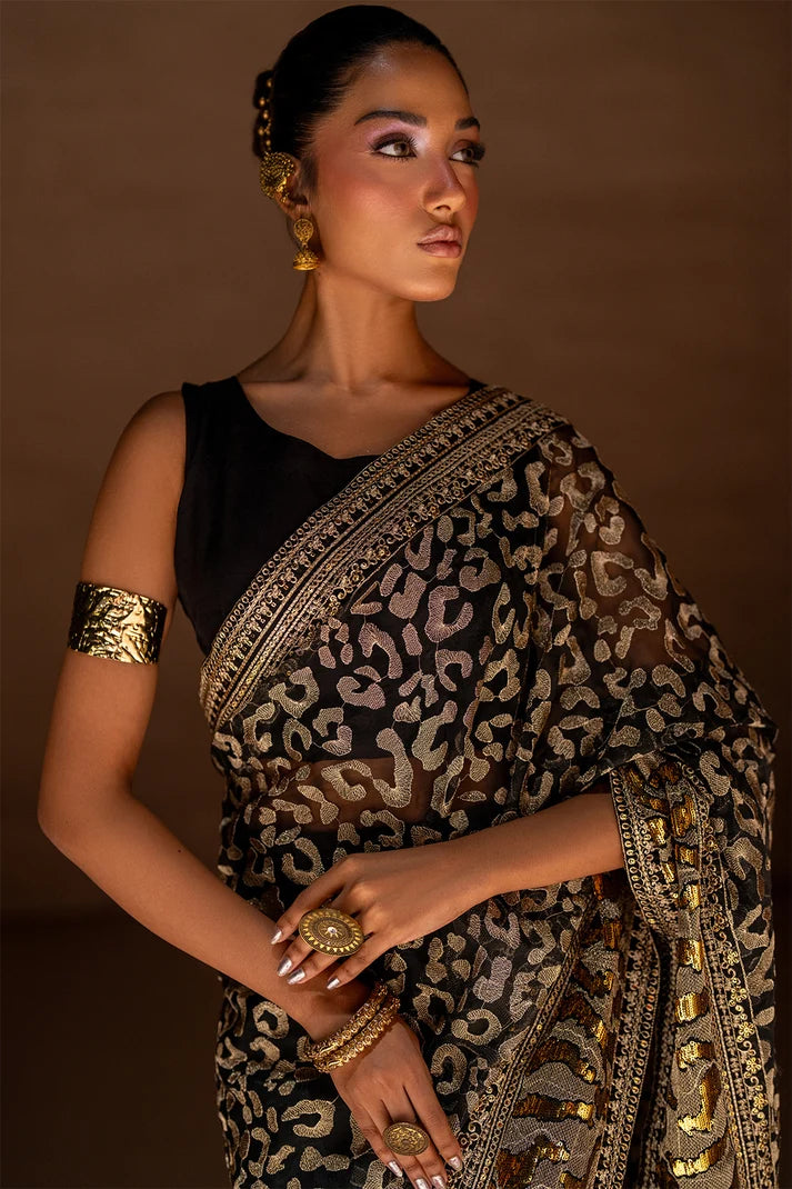 Women wearing black designer saree pakistan as an evening look, shop organza saree online at Buraqstore