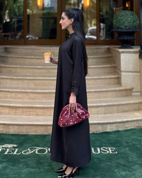 Women wearing black pashmina suit, close-up of the soft pure pashmina fabric texture, Buraqstore