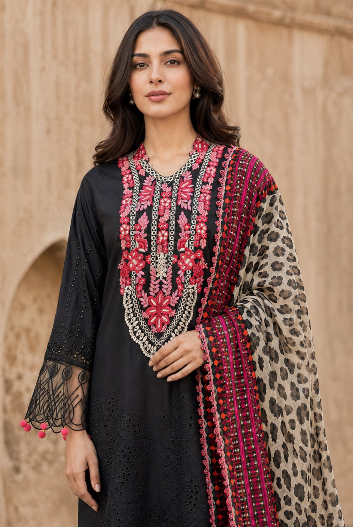 Women wearing black pakistani chikankari suits online with price set with digital printed chiffon dupatta draped on the shoulder, Buraqstore