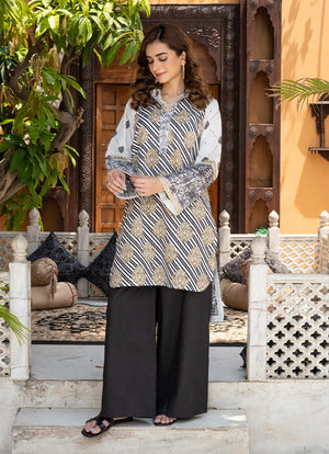 Model wearing black and white dress, a printed lawn shirt and trouser 2PC, front view from Buraqstore