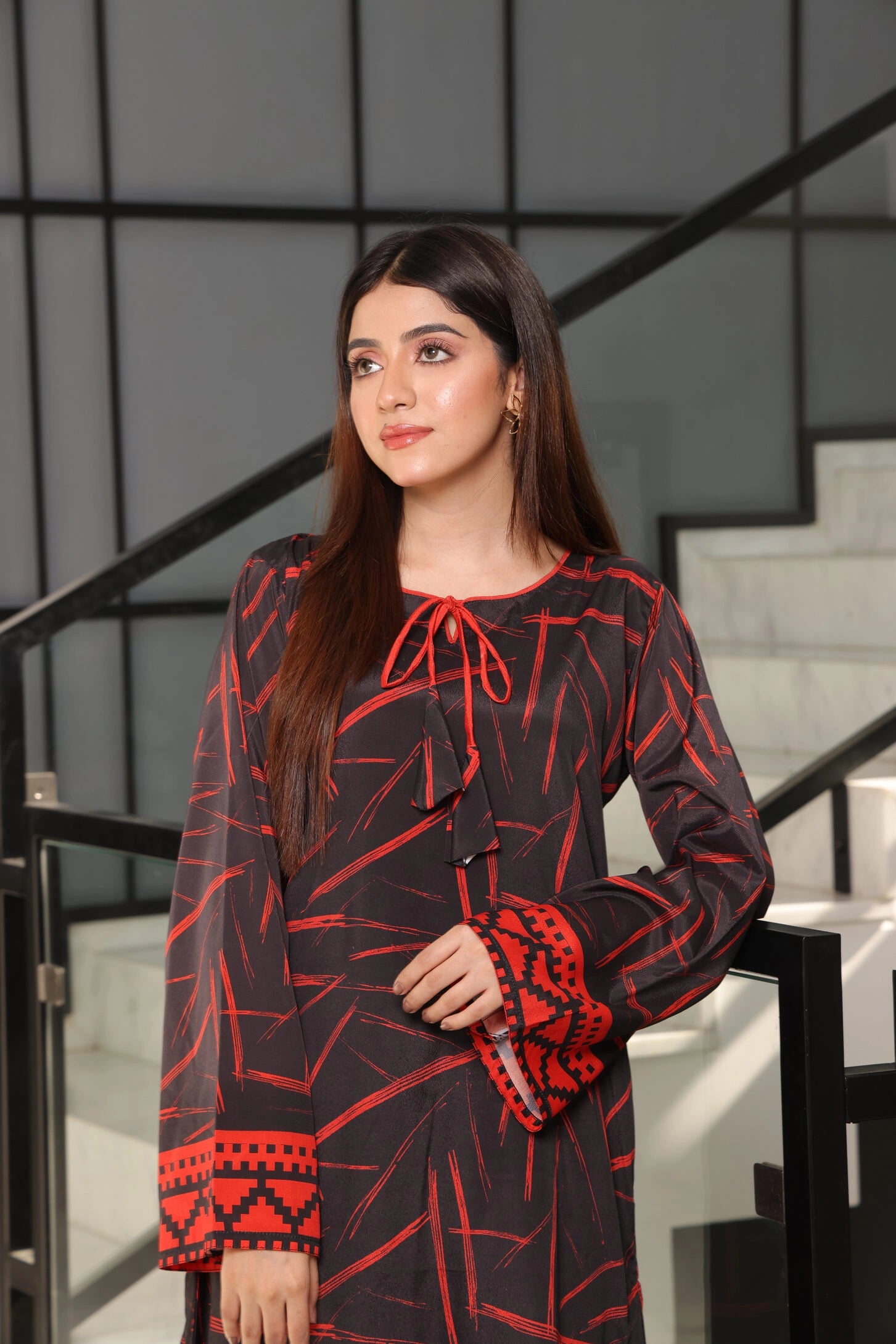 woman posing in Buraqstore two piece pret outfit with simple black dress design for everyday elegance