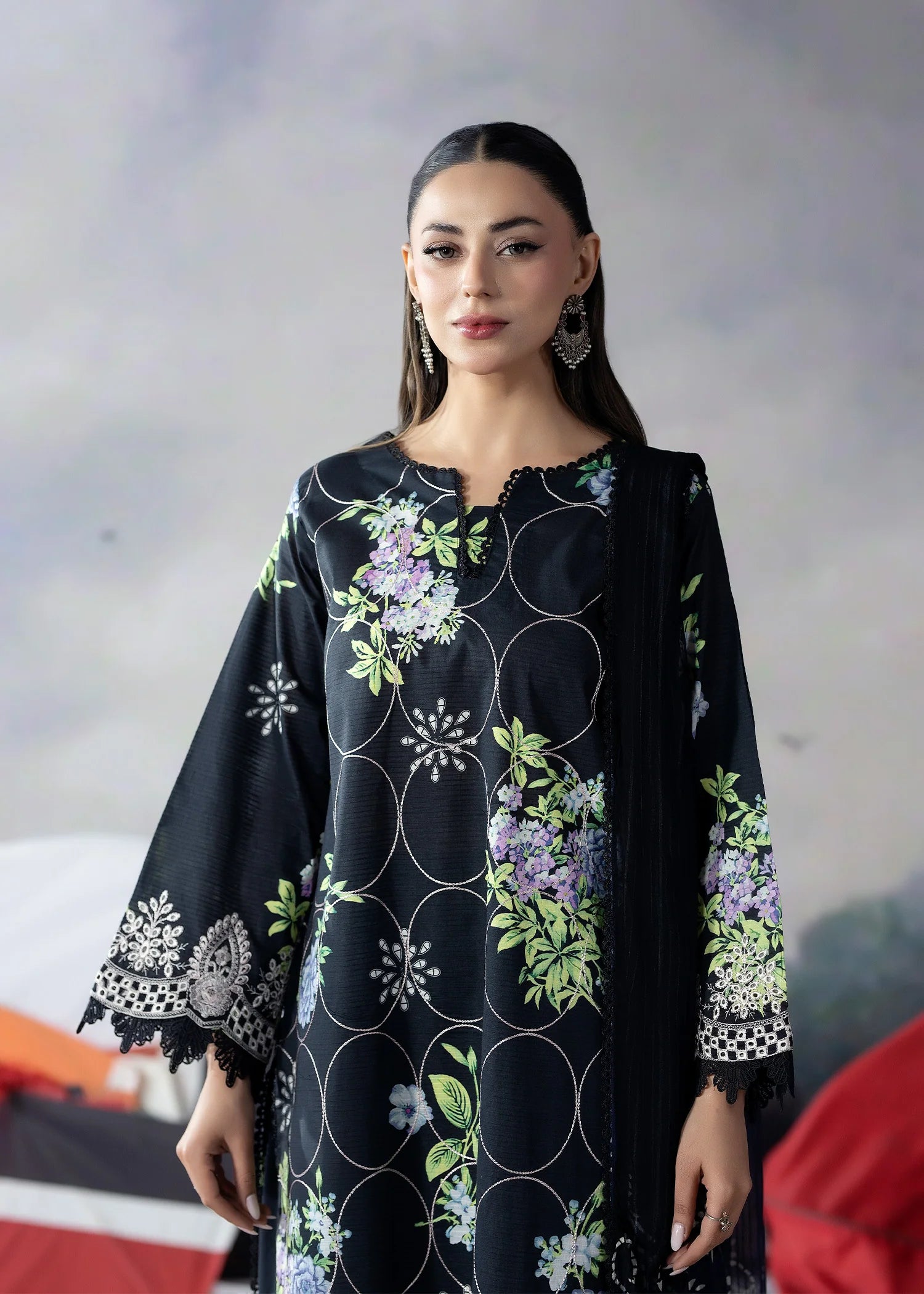 girl posing in Buraqstore embroidered lawn 3PC with black embroidered dress styling and graceful finish