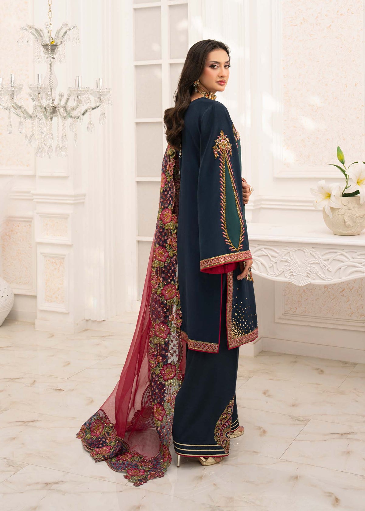 Model showcasing a black red Jamnii embroidered organza dress at Buraq Store