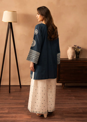 Women wearing blue dress design, close-up of the embroidery on the white lawn shirt, Buraqstore