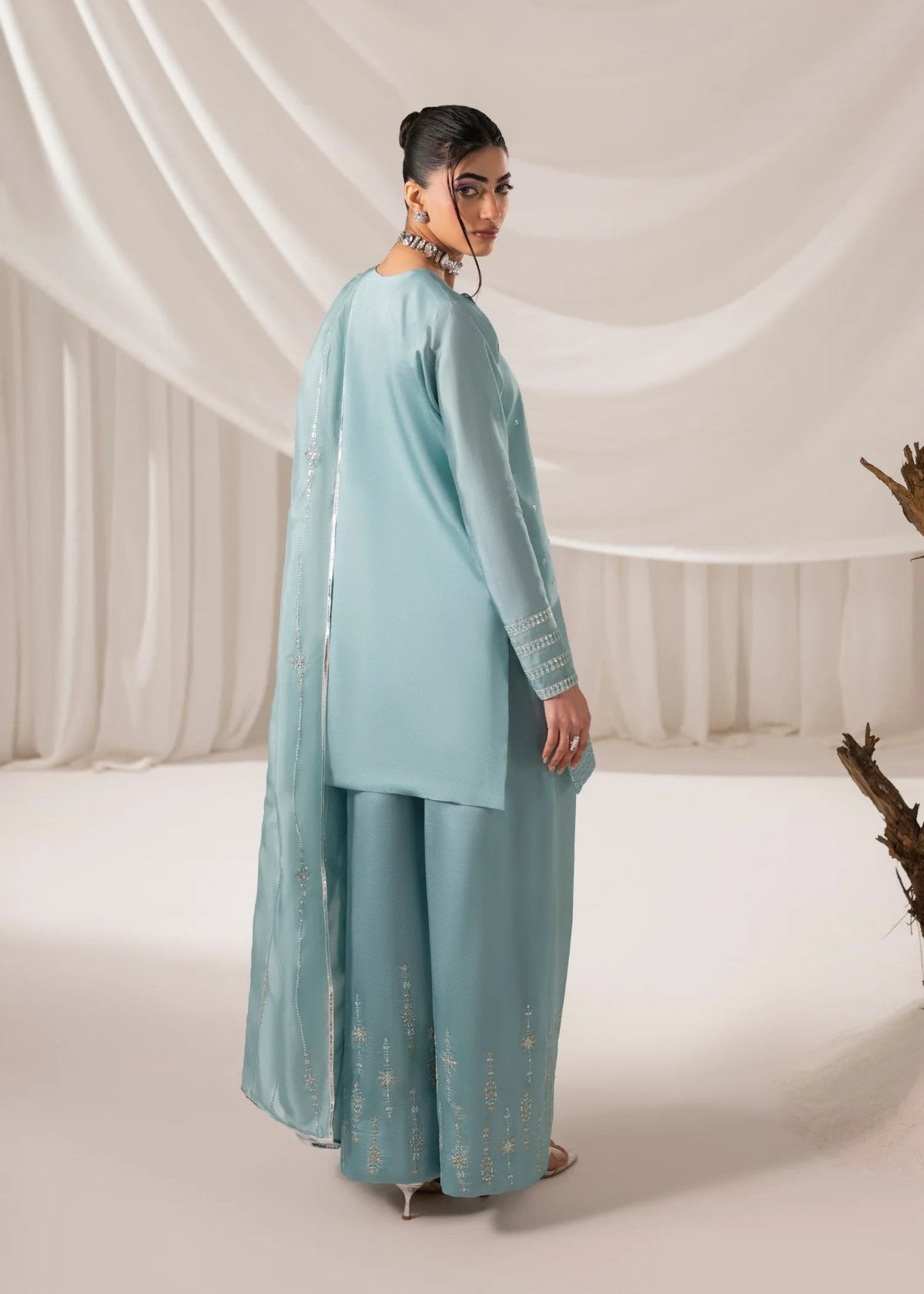 Model wearing blue Jamnii 3 piece women's suit from Buraq Store