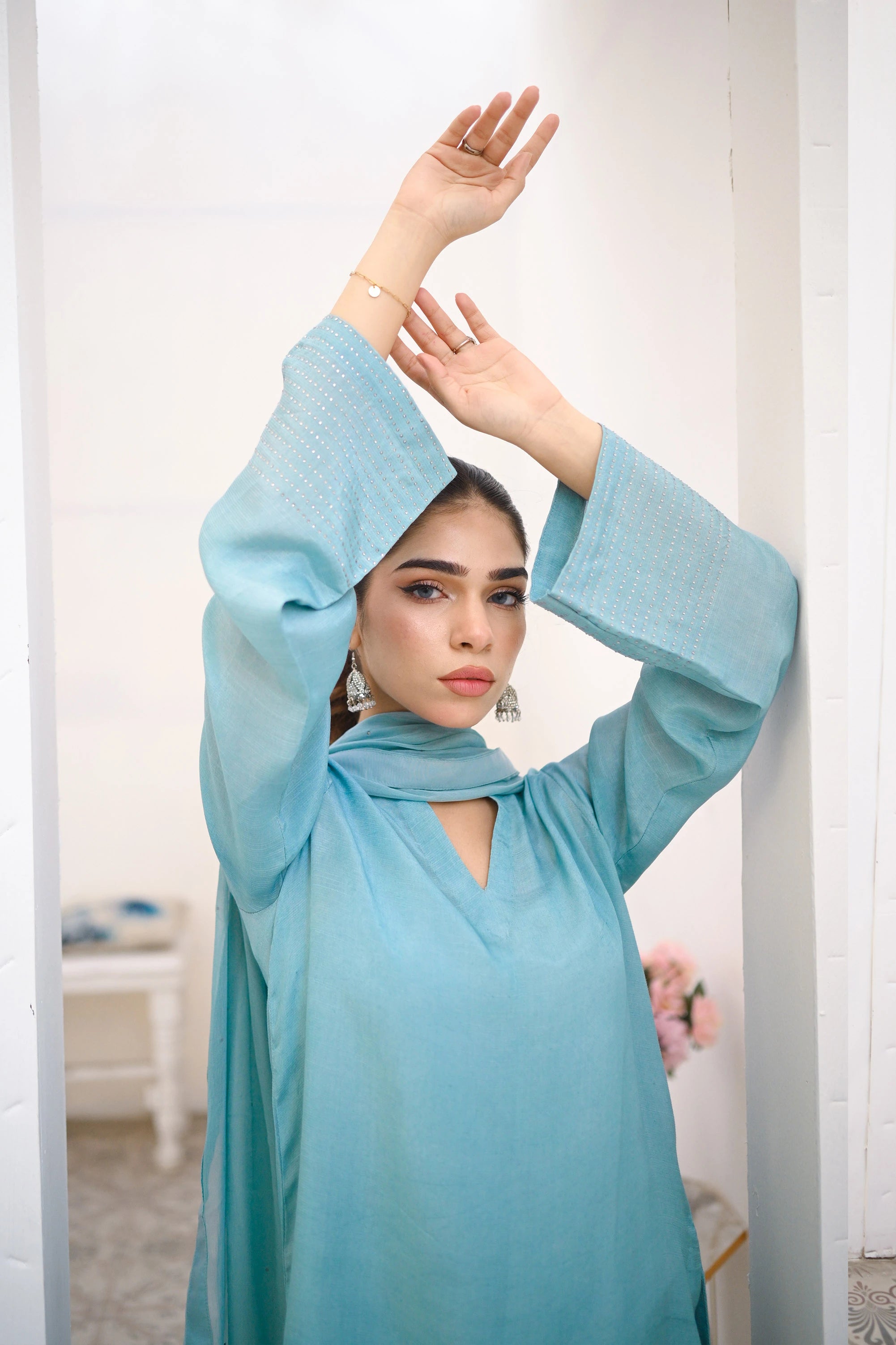 woman posing in blue velvet dress by Buraqstore formal evening wear