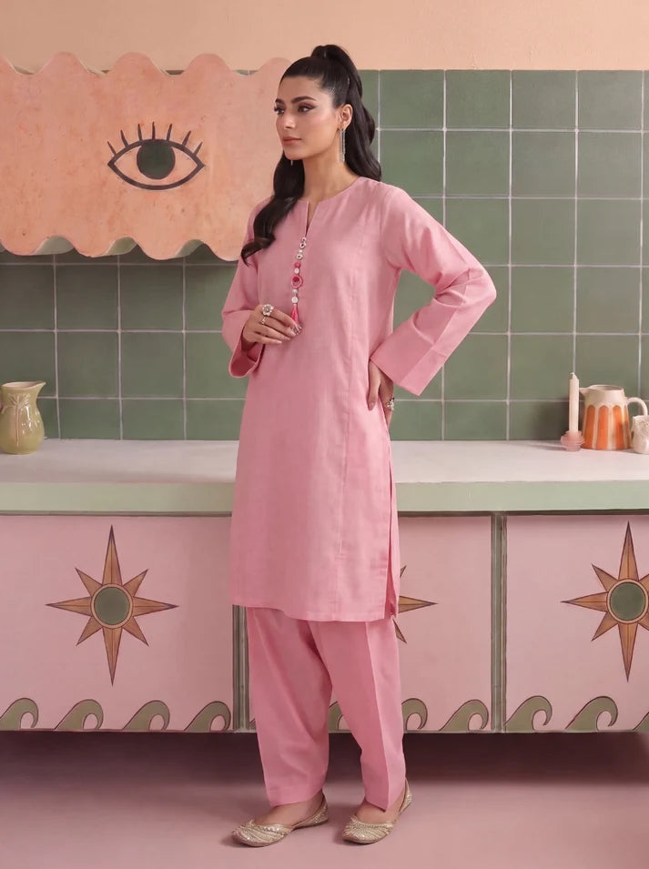 Model wearing blush pink dress, side view showing the fit of the shirt and trouser 2PC, Buraqstore
