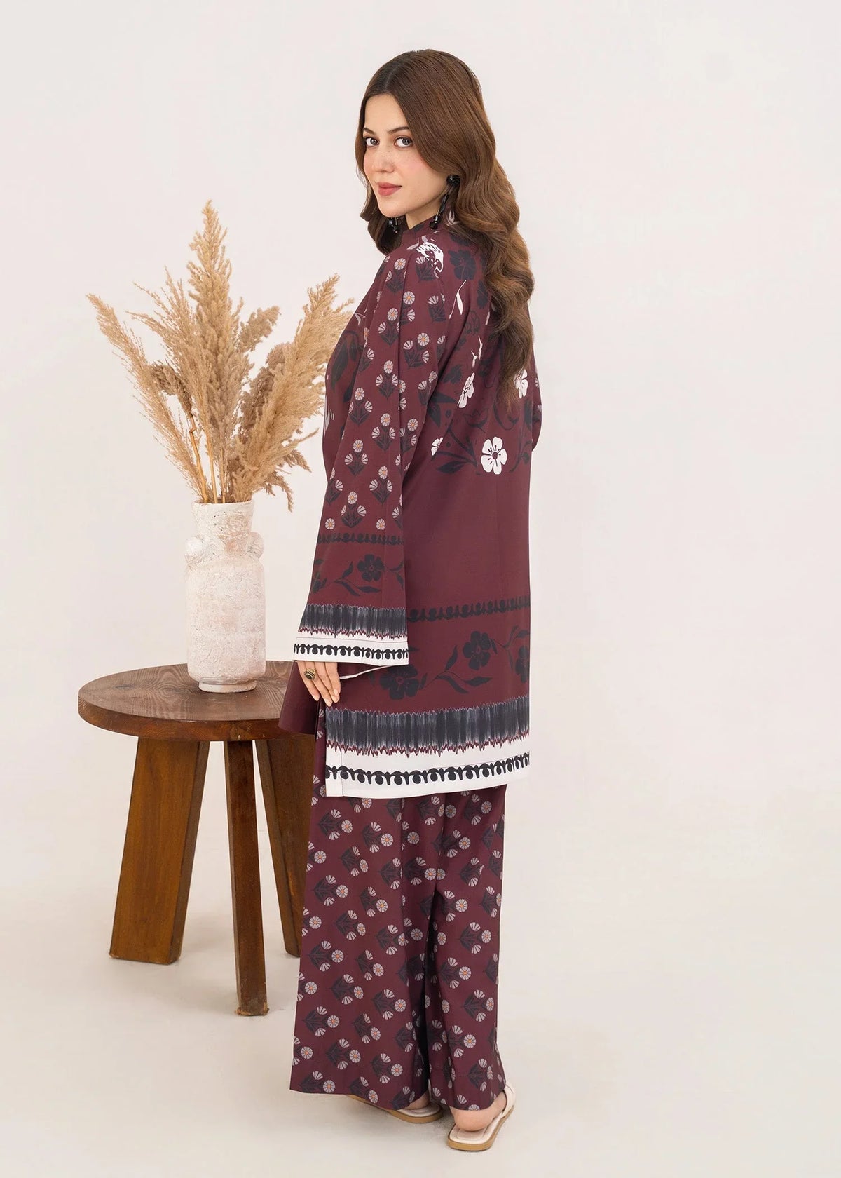 Women wearing brown printed co ord set in a relaxed standing pose, grip fabric 2-piece at Buraqstore