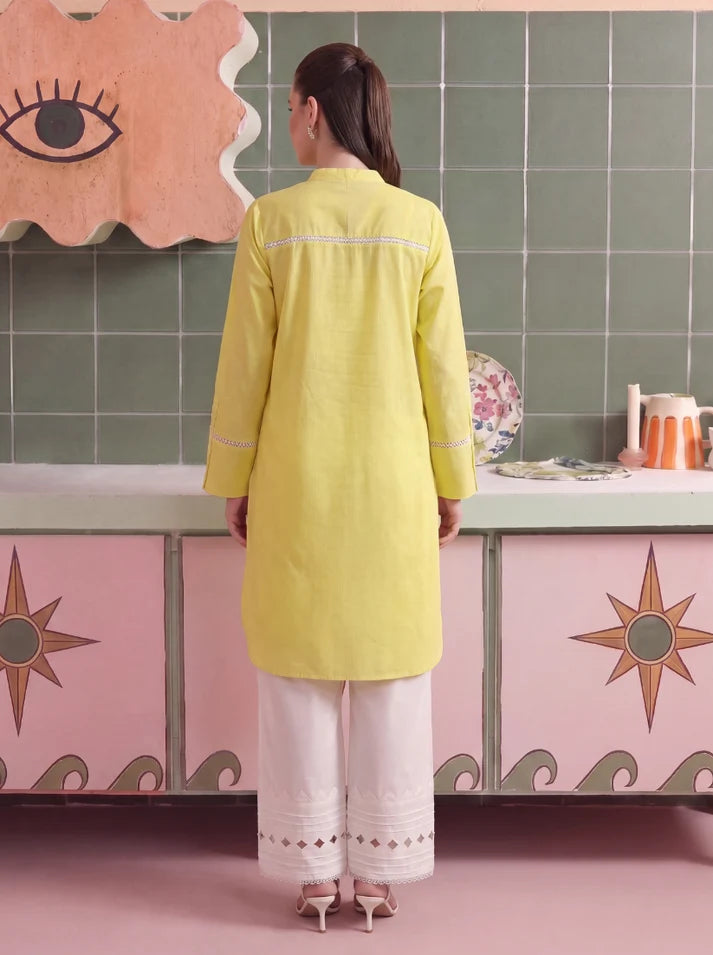 Model wearing buttercup dress, side view showing the fit of the shirt and trouser 2PC, Buraqstore