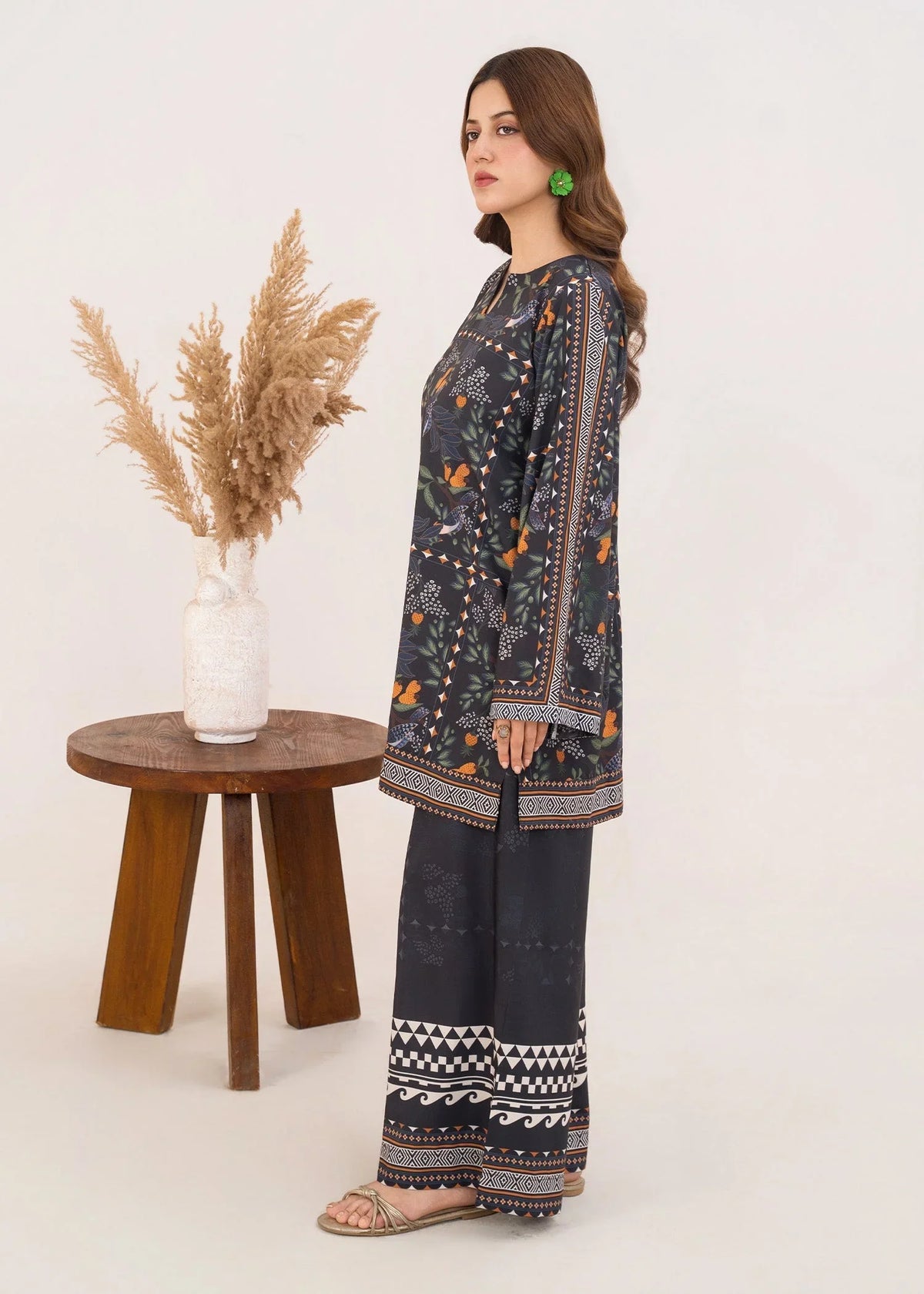 Model wearing black dress pakistan set as a daily outfit, shop printed grip 2PC set at Buraqstore