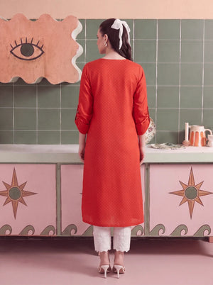Women wearing coral color dress, back view of the stitched cambric shirt and matching trouser, Buraqstore