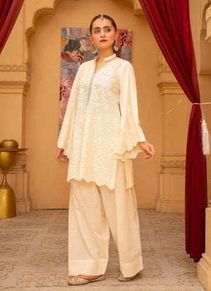 Model wearing cream color dress, side view showing the fit of the bana dora 2-piece set, Buraqstore