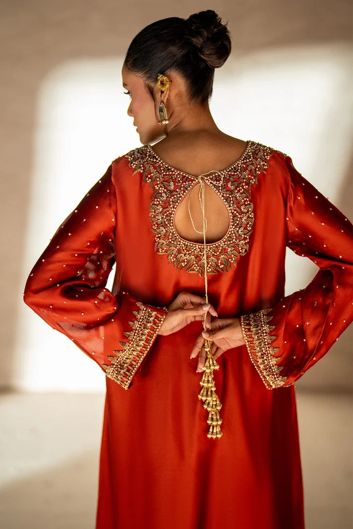 Women wearing deep rust kaftan dress price in pakistan set, close-up of handcrafted antique gold embroidery, Buraqstore