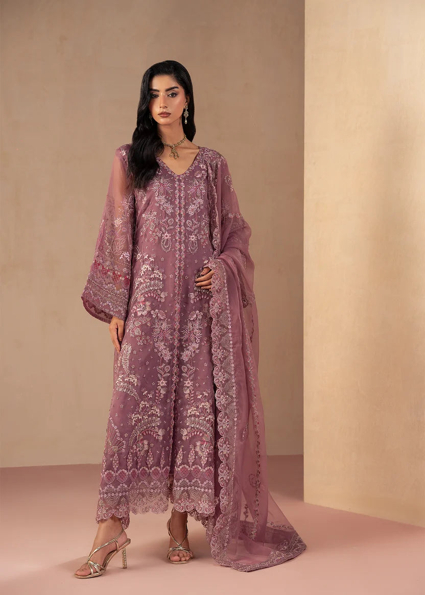 Model wearing purple dress design in a dusty plum shade, embroidered net shirt with grip trouser, front view from Buraqstore