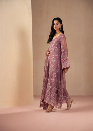 Woman wearing purple dress design, close-up of the embroidery and embellishment on the net shirt, Buraqstore
