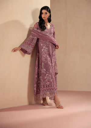 Model wearing purple dress design, side view showing the fit of the net shirt and grip trouser, Buraqstore