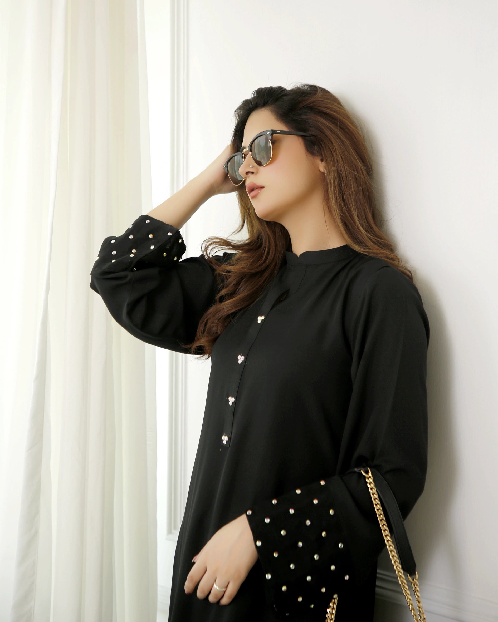 woman posing in black dress design buraqstore with two piece styling