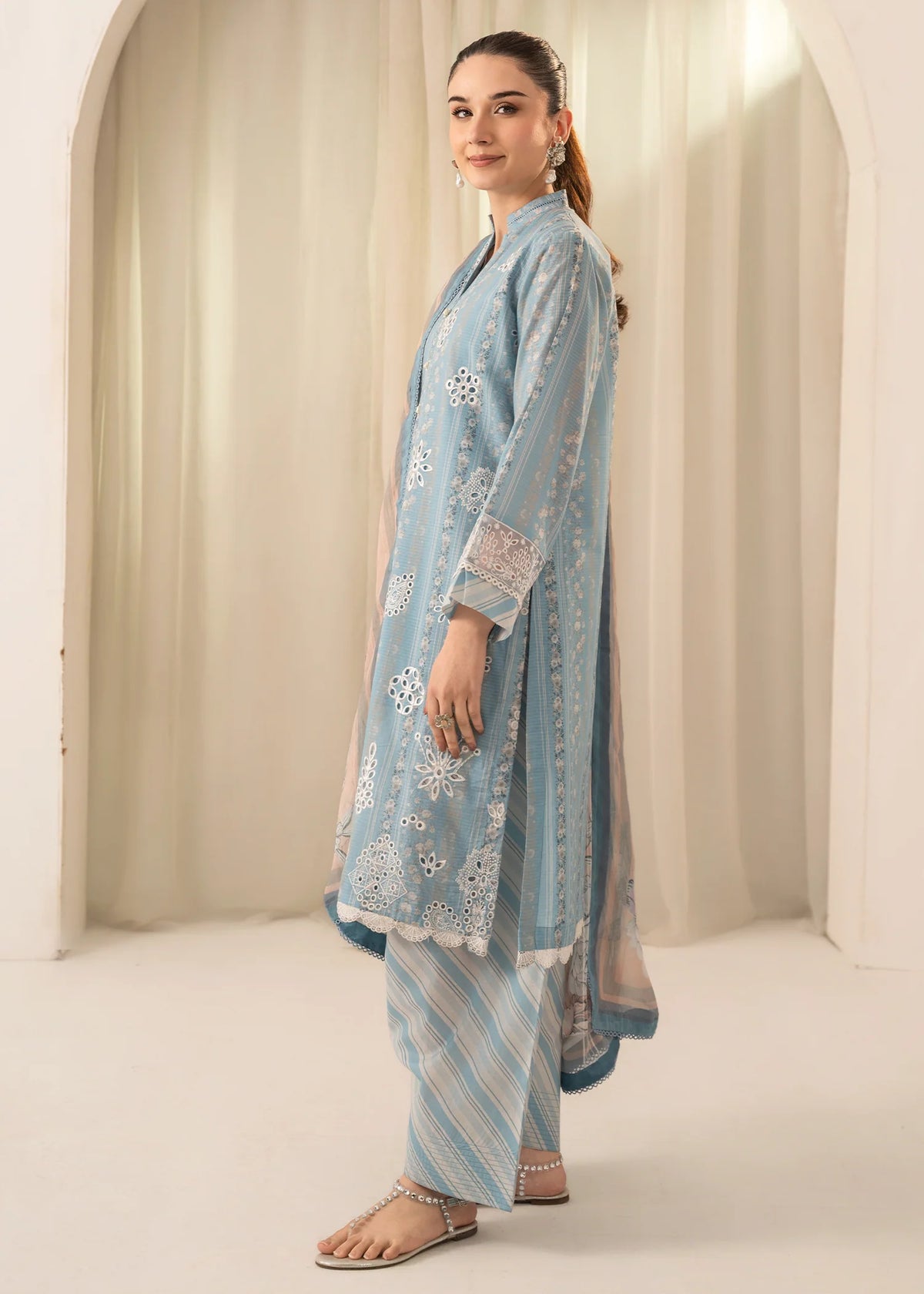 Woman wearing a Meerak embroidered Chikankari lawn suit from Buraq Store