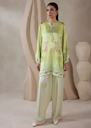Model wearing co ord set design in green, a printed charmeuse silk top and bottom, front view from Buraqstore