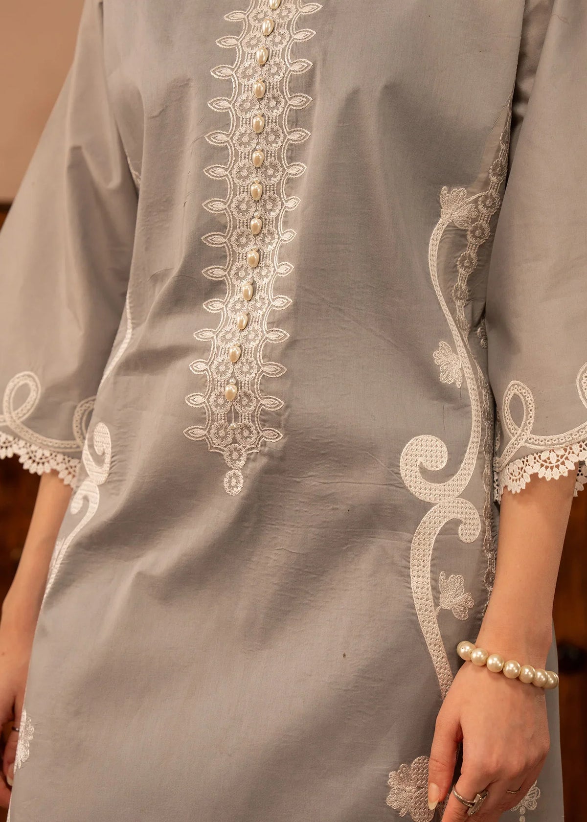 Women wearing simple lawn dress design, back view of the embroidered shirt and trouser, Buraqstore