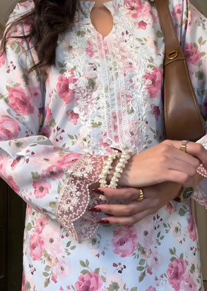 Women wearing ice blue dress, close-up of the lace and embroidery detail on the printed viscose shirt, Buraqstore