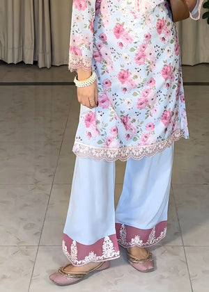 Model wearing ice blue dress, side view showing the soft drape of the printed viscose 2PC, Buraqstore