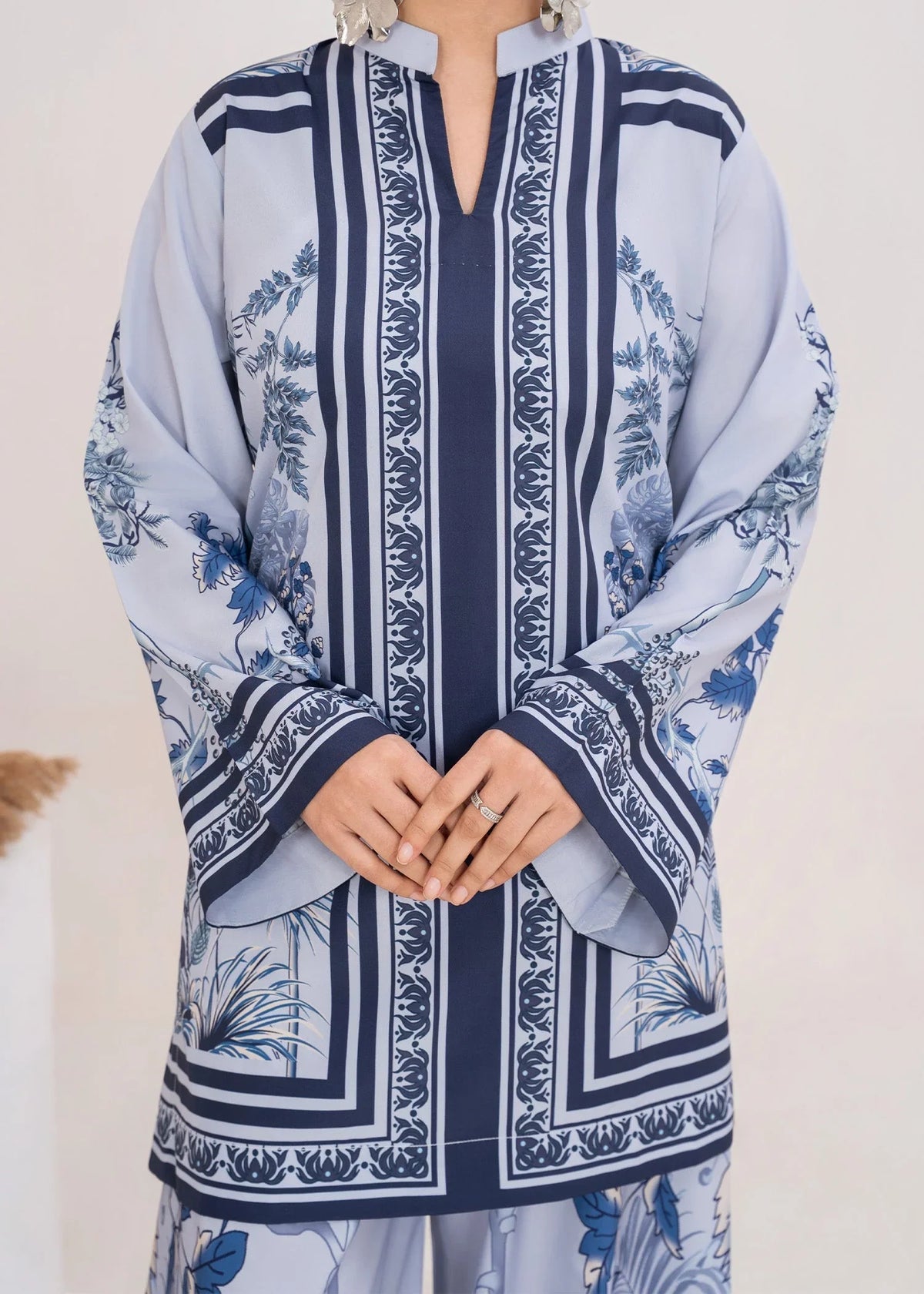 Model wearing ice blue color dress, side view showing the fit of the printed poly lawn 2PC, Buraqstore
