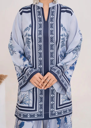 Model wearing ice blue color dress, side view showing the fit of the printed poly lawn 2PC, Buraqstore