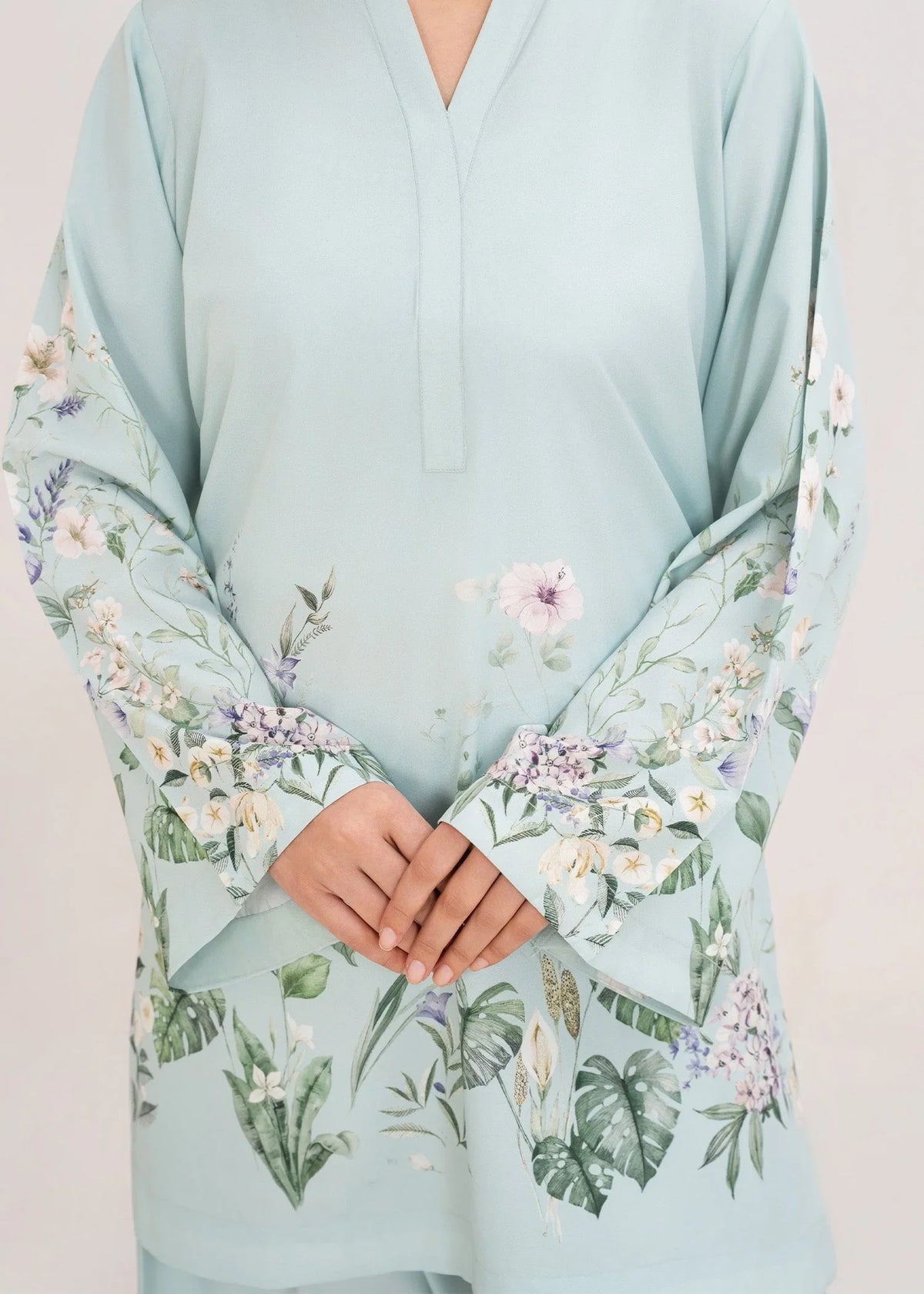 Model wearing ice blue summer co ord sets Pakistan for warm days, shop printed poly lawn 2-piece at Buraqstore