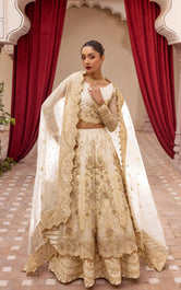 Bride wearing pakistani bridal lehenga crafted in net with heavy embellishment by Buraqstore