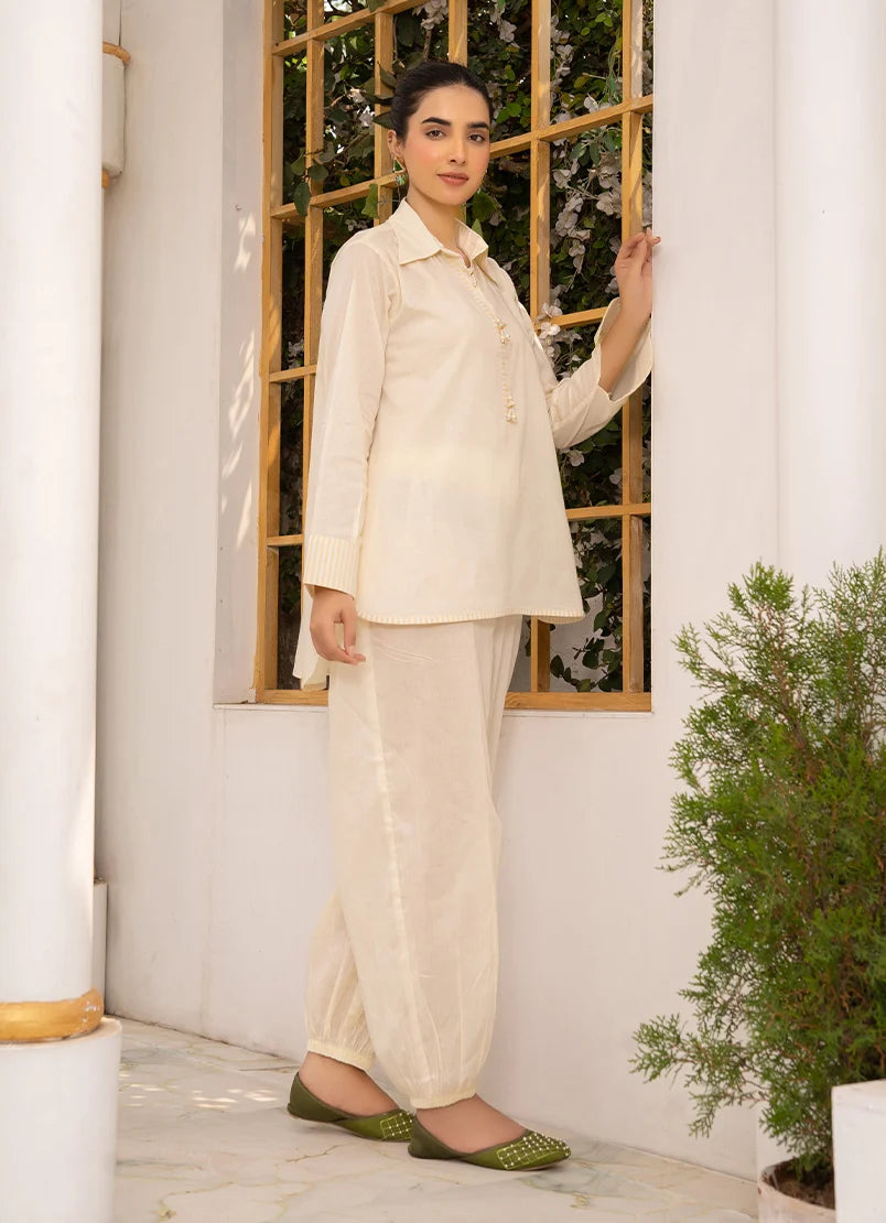 Women wearing co ord sets, close-up of the dori and lace detail on the cotton top, Buraqstore