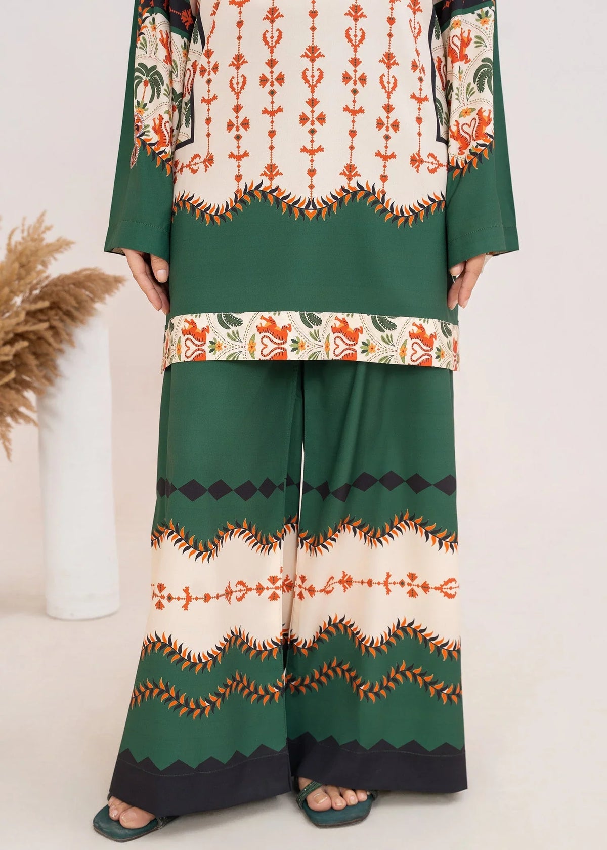 Model wearing silk dress design, side view showing the smooth fall of the printed silk 2PC, Buraqstore