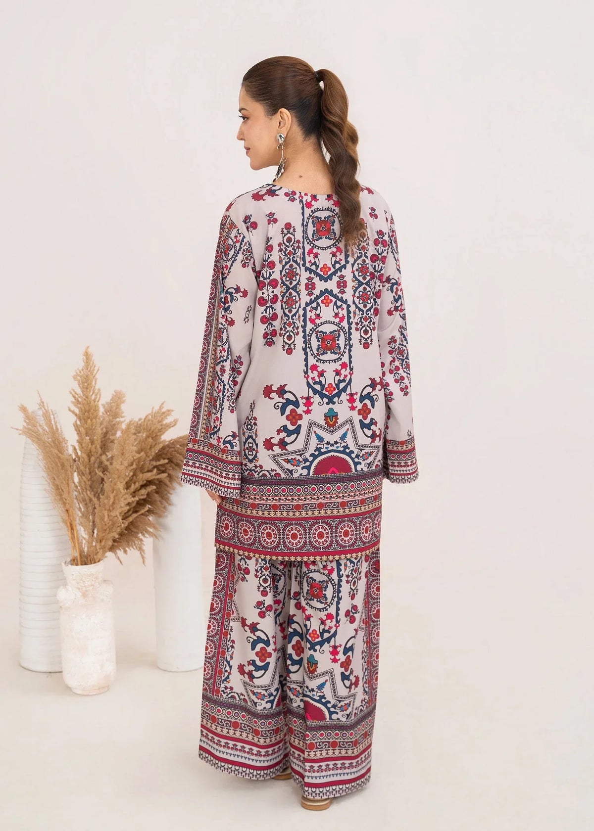 Model wearing ivory lawn co ord sets Pakistan in a relaxed standing pose, printed poly lawn 2-piece at Buraqstore