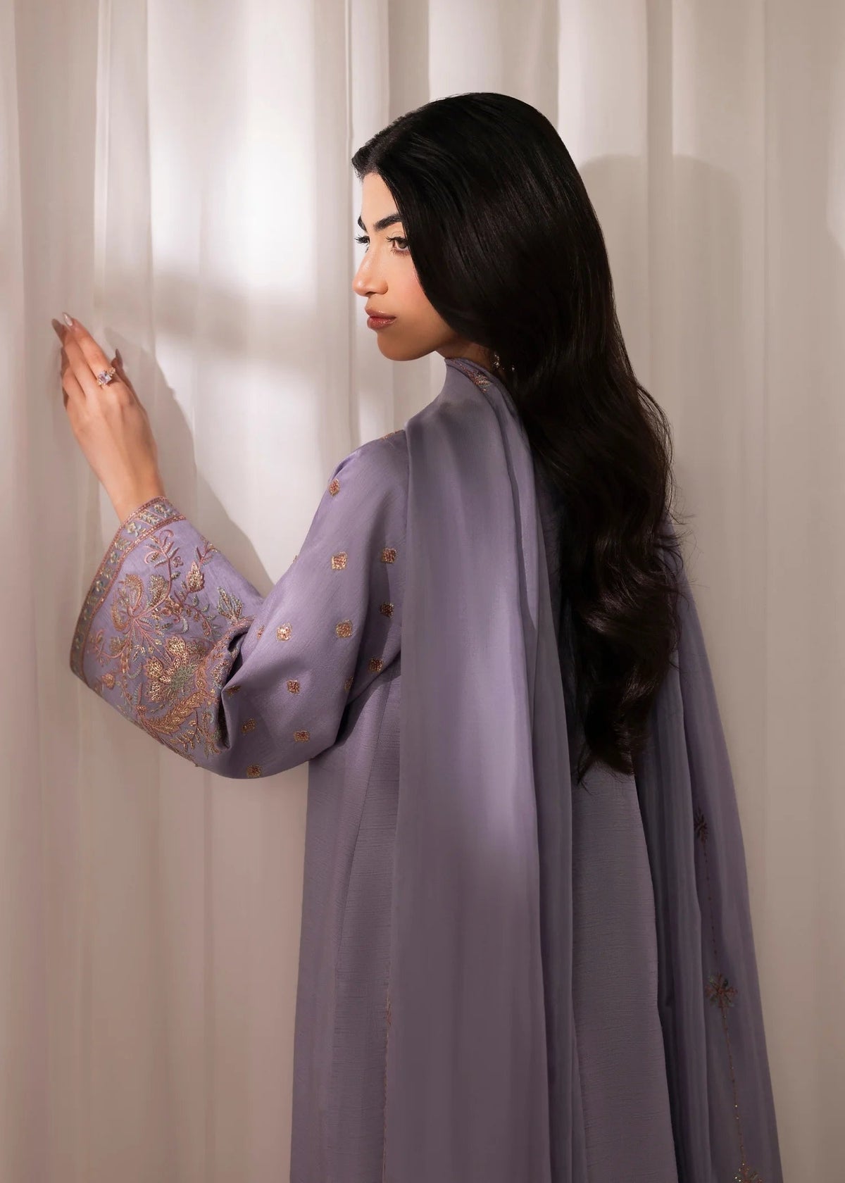 Model showcasing a lavender Jamnii Korean silk pret 3 piece suit at Buraq Store