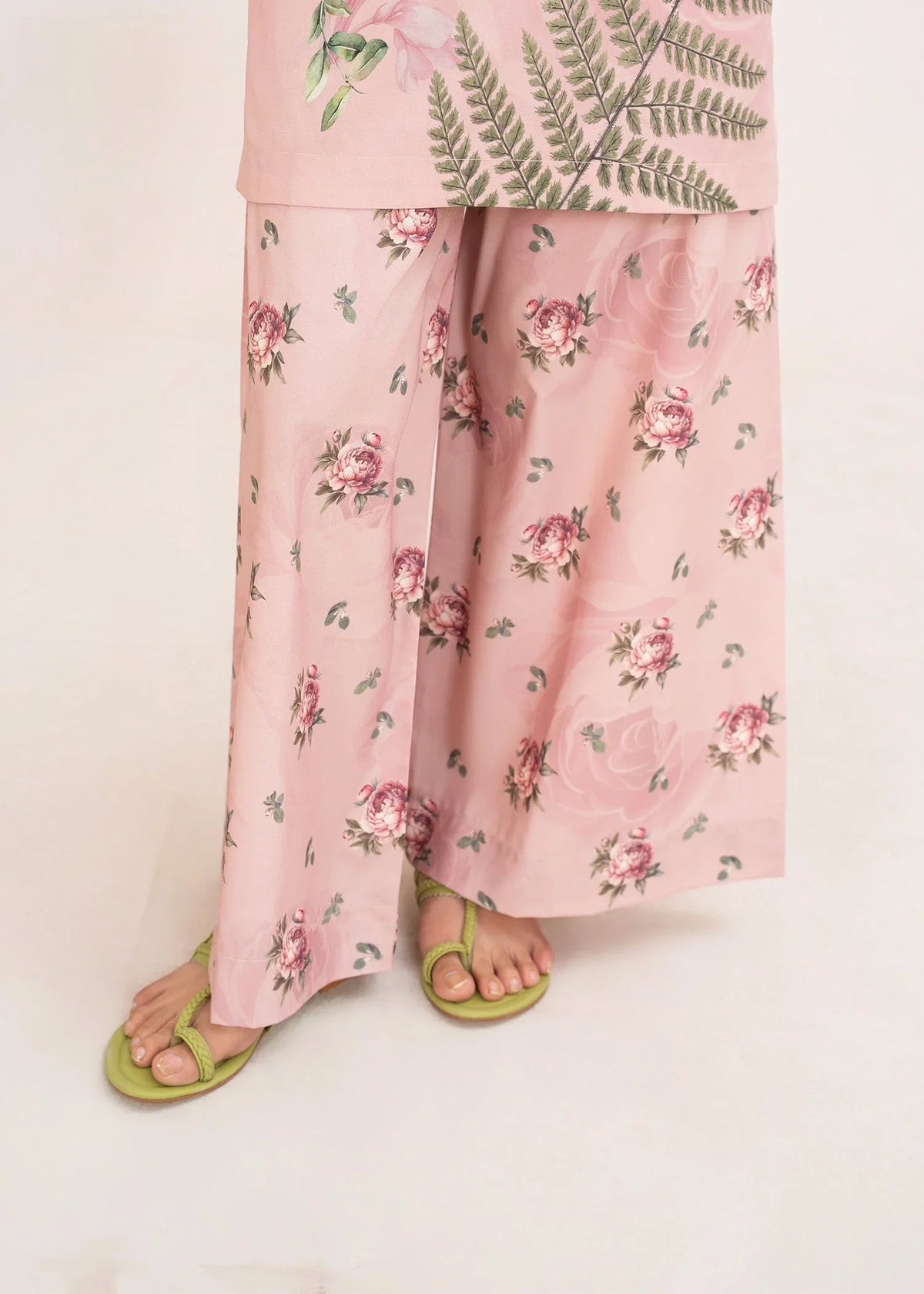 Model wearing pink color dress, side view showing the fit of the printed poly lawn 2PC, Buraqstore