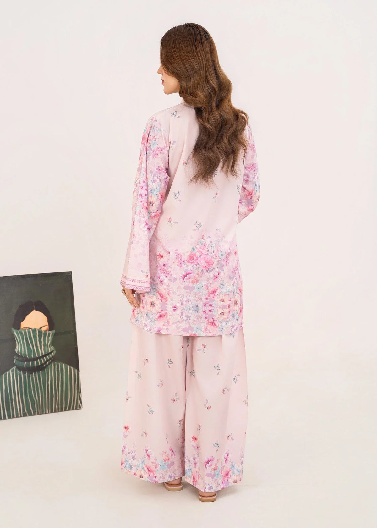Women wearing pink color dress pakistani set, close-up of the print on the poly lawn shirt, Buraqstore