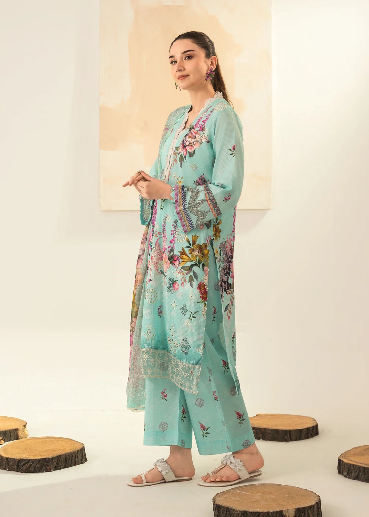 Woman wearing a light blue Meerak embroidered Chikankari suit from Buraq Store