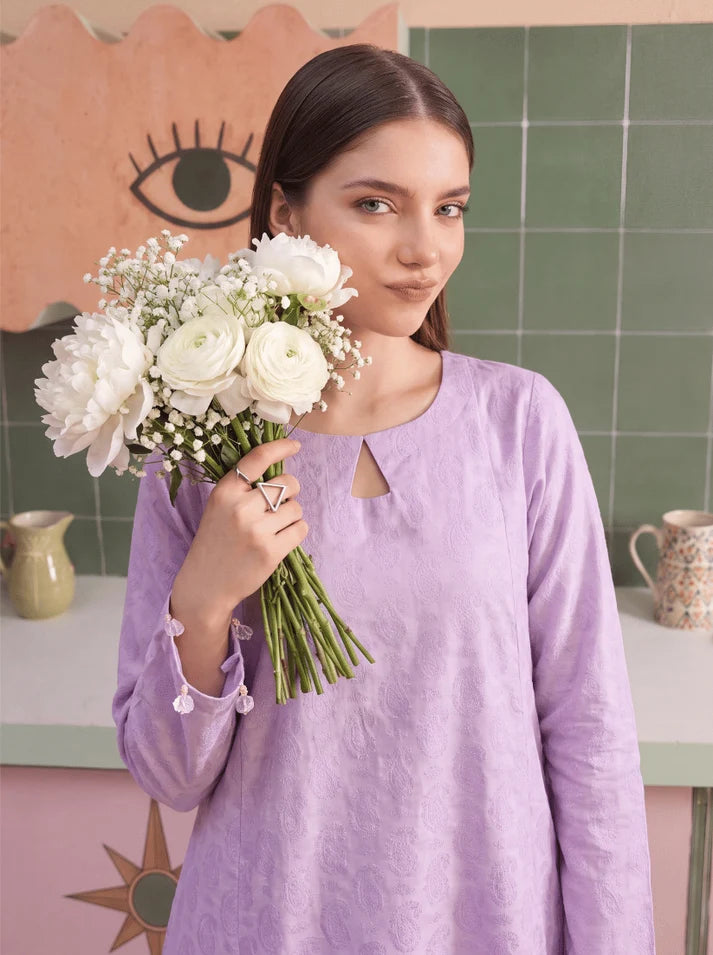Model wearing lilac color dress, side view showing the fit of the shirt and trouser 2PC, Buraqstore